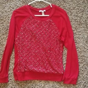 Red long sleeve top.